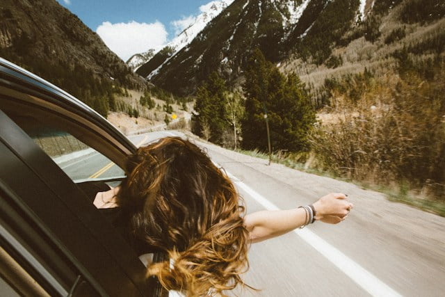 Woman Travelling Head Outside Window