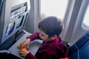Passenger making sure to keep your airplane seat clean during flight