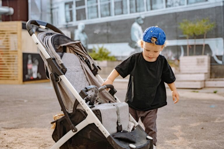boy-child walking outside near stroller