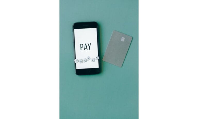 black smartphone on green background