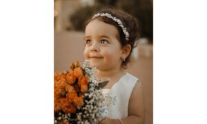 cute girl holding a bouquet of flowers