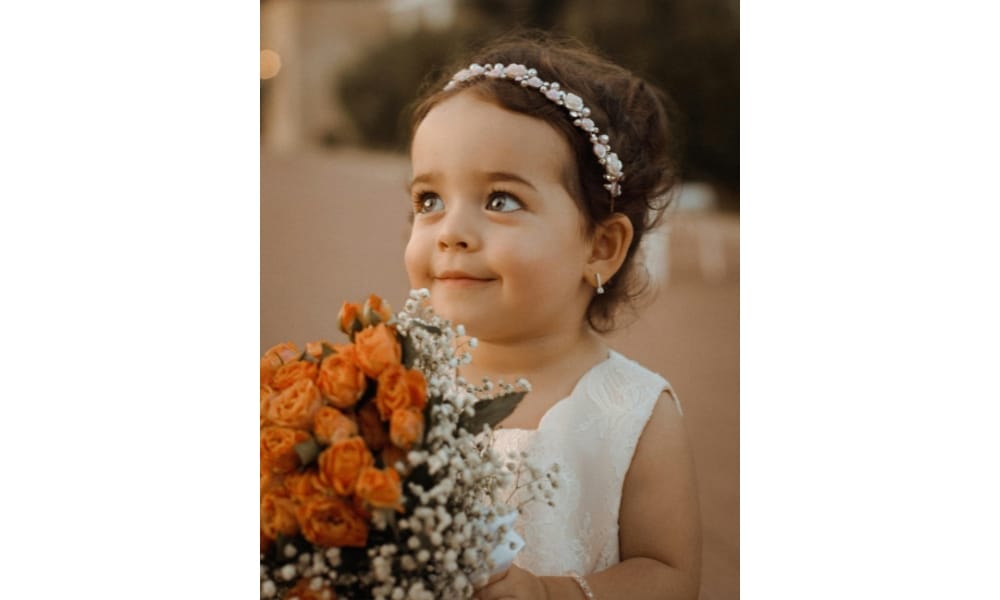 cute girl holding a bouquet of flowers
