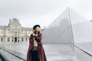 Woman Standing by the Water Fountain with Pyramid