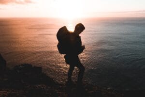 Solo hiker following solo hiking safety tips and sharing route details before setting off