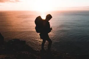 Solo hiker following solo hiking safety tips and sharing route details before setting off