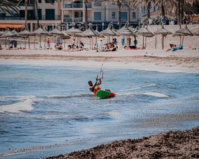 Man in red shirt riding red kayak on sea during daytime