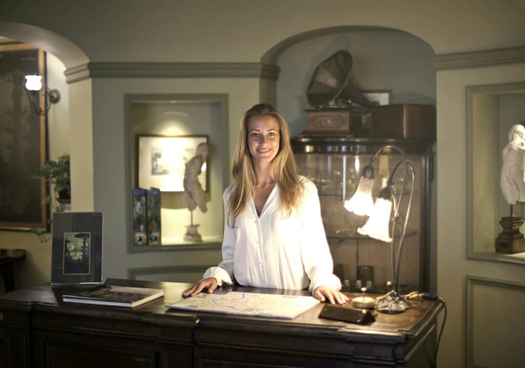 women standing behind front desk to enjoy local shops travel experience