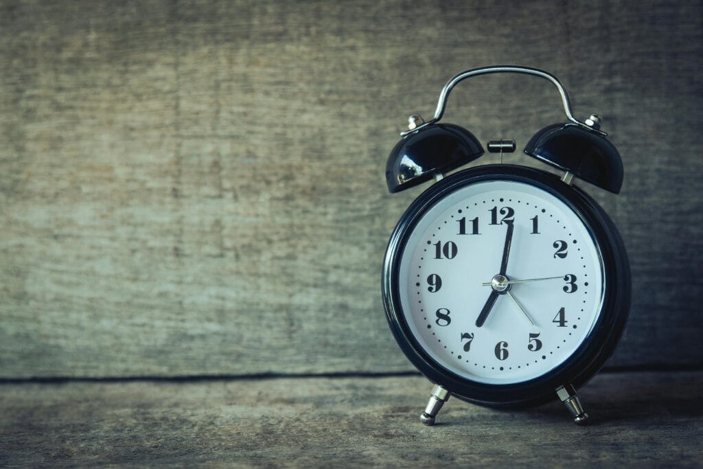 black analog alarm clock