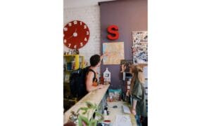 Tourist Pointing on Map