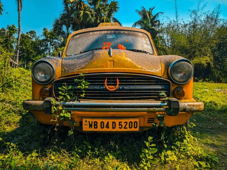 Close-up Photo of Yellow Vintage Car