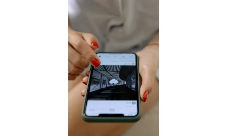 Woman Pressing Like Button on Instagram Feed on Black Android Phone