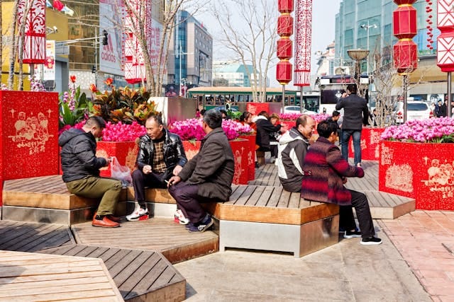 People relaxing in the city with traditional Chinese Decorations, China