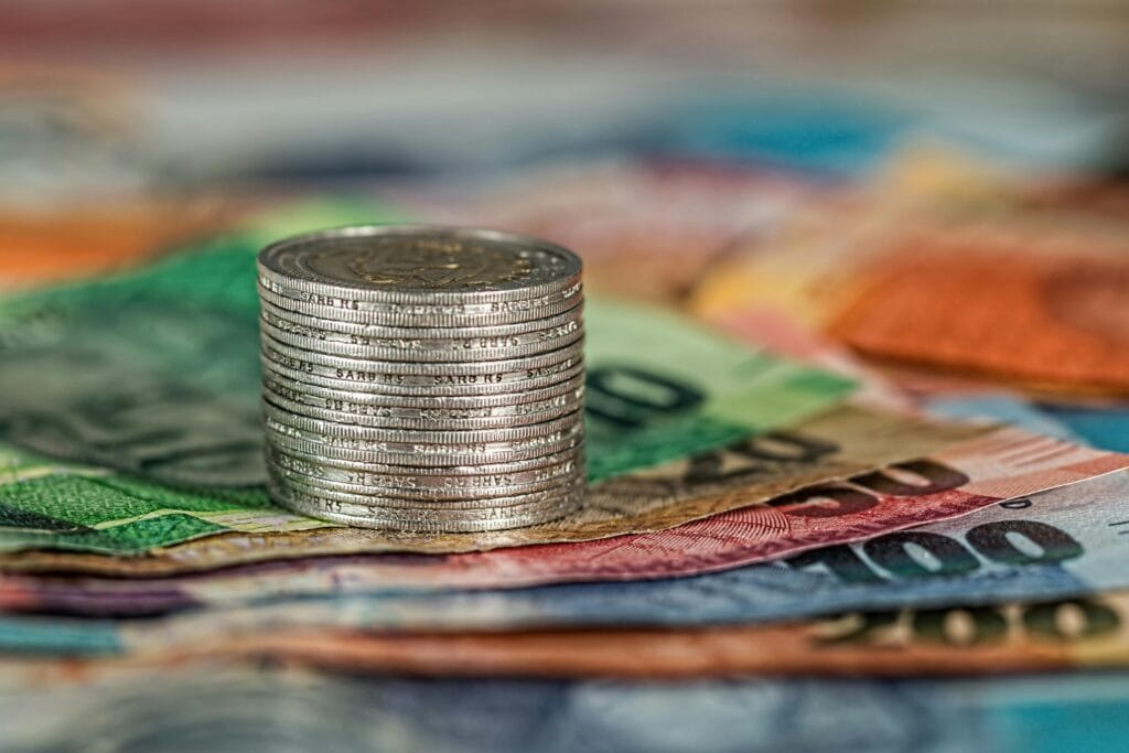 Assorted Banknotes and Round Silver-colored Coins. arrive with local currency for a smooth and stress-free arrival.