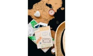 Passport and Compass on Top of Maps