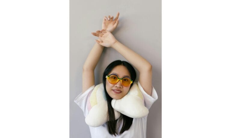 A Woman in White Shirt Wearing Colorful Sunglasses