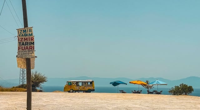 Scenic View of Yellow Bus and Beach Umbrellas in Izmir