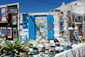 a table topped with lots of plates and bowls