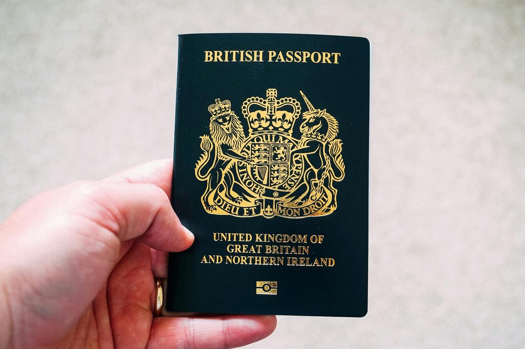 : Close up of an open passport showing issue and expiry dates highlighted for EU travel checks