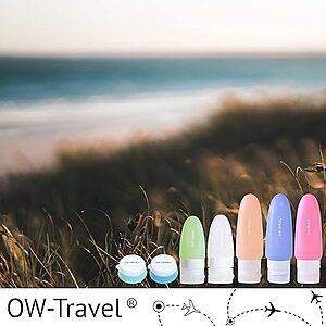 Set of silicone travel bottles, jars and toiletry accessories neatly arranged beside a clear airport compliant toiletry bag