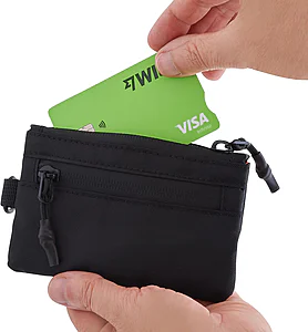 Close-up of an RFID wallet holding passport and cards, highlighting organised compartments and compact design for travel use