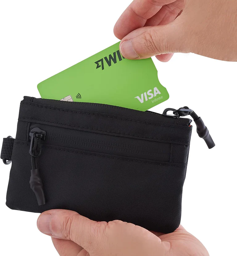 Close-up of an RFID wallet holding passport and cards, highlighting organised compartments and compact design for travel use