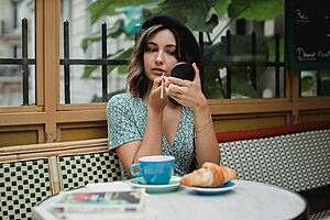 Compact pocket mirror displayed on travel pouch showing foldable casing, slim design and clear reflective surface for everyday grooming