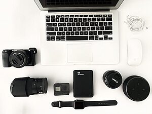Laptop and camera accessories covered with gadget travel insurance