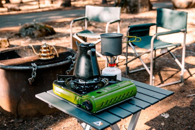 portable stove cooking at campsite