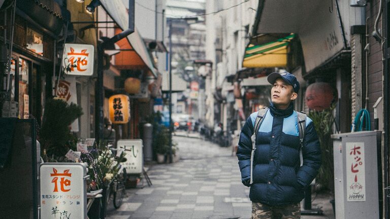 Solo traveller walking through the streets of Japan