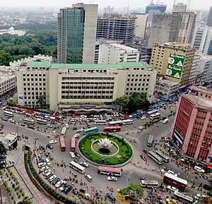 Aerial view of a busy traffic roundabout and city buildings in Dhaka Bangladesh
