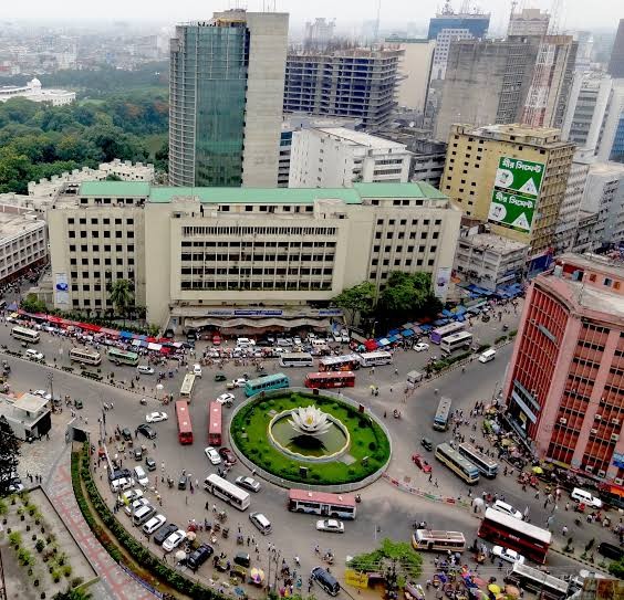 Aerial view of a busy traffic roundabout and city buildings in Dhaka Bangladesh