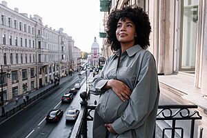 Pregnant woman sightseeing comfortably during second trimester