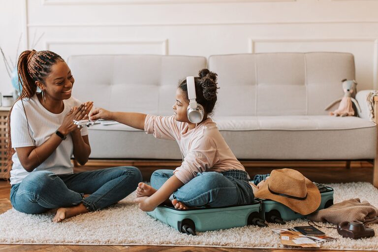 Young Gen Z family packing for a weekend micro trip