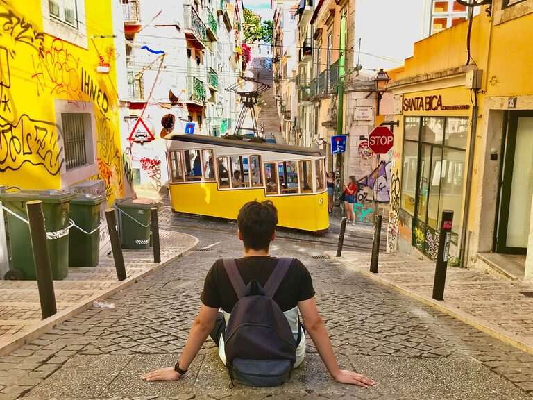 Teen exploring Lisbon tram route in Portugal