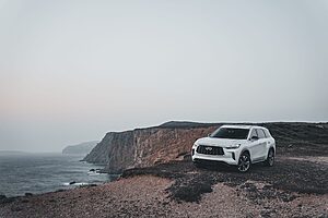 Car parked in scenic coastal road for a honeymoon trip