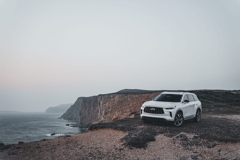 Car parked in scenic coastal road for a honeymoon trip