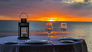 Private candlelit dinner setup for a romantic honeymoon